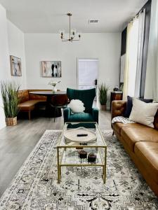a living room with a couch and a coffee table at Charming Canal Street Family Retreat in Heart of NOLA in New Orleans