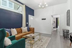 a living room with a couch and a table at Charming Canal Street Family Retreat in Heart of NOLA in New Orleans