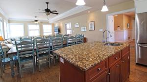 a kitchen and dining room with a table and chairs at 209 Congress Street in Cape May