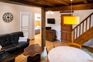 a living room with a couch and a table at Mas Les Albas in Felluns