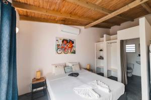 Postel nebo postele na pokoji v ubytování Pink Lagoon by Boutique Bonaire Unique Resorts