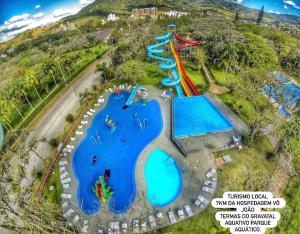 an aerial view of a water park with slides at Hospedagem Vô João in Gravatal