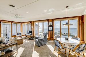 a living room with a view of the ocean at Pool and Stunning Water Views Kent Island Home! in Stevensville