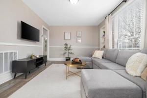 a living room with a couch and a table at 2BR house minutes from Holston Valley & Eastman in Kingsport