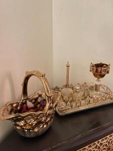 a basket and a tray with a candlesticks on a table at Your new comfortable home with us in Laayoune