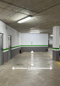 an empty parking garage with a basketball hoop in it at Barthe Holidays I Apartamento Moderno en Arinsal 5PAX I Ideal grupo o familia, Parking I Perafita in Mas de Ribafeta