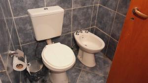 a bathroom with a toilet and a bidet at Departamento turístico SMA in San Martín de los Andes
