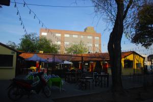 a group of tables and chairs and a building at Terra Alta Suites in Salta