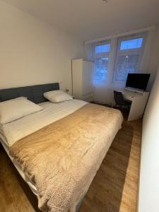 Ένα ή περισσότερα κρεβάτια σε δωμάτιο στο PRV Apartments