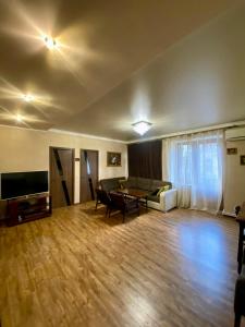a living room with a couch and a table at Family Apartment in Yerevan