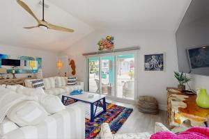 a living room with a white couch and a table at Manasota Key Dream in Englewood