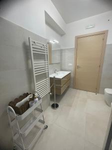 a bathroom with a toilet and a sink at "O Funnucu Baruni" in Giarre +45 photos
