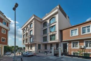a building with a car parked in front of it at Hanna Hotel in Istanbul