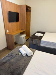 Postel nebo postele na pokoji v ubytování Casa aconchegante próximo ao Fórum