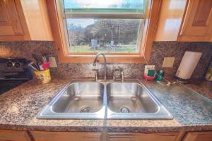 a kitchen sink with a window above it at RR 9122SF Sunflower Cabin in Canyon Lake