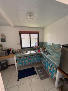 TV a/nebo společenská místnost v ubytování Fare 'Una'Una - Fakarava