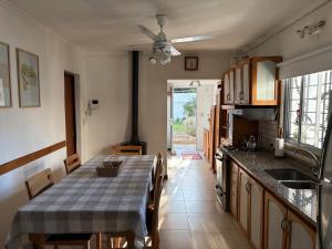 a kitchen with a table with a table cloth on it at Casa Rita in Gualeguaychú
