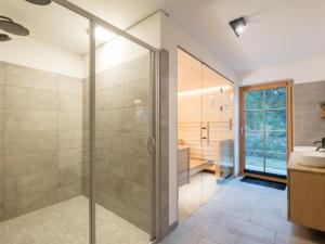 a bathroom with a shower and a sink at Schletski in Donnersbachwald +39 photos