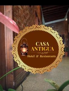 a sign that reads casa antigua hotel and restaurant at Hotel y Restaurante Casa Antigua in San Antonio Suchitepéquez