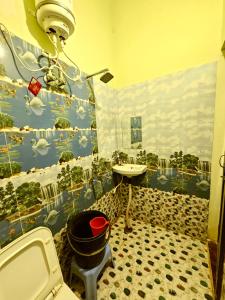 a bathroom with a sink and a bath tub at Suryakulam palace in Ayodhya