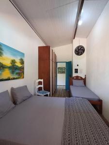 Katil atau katil-katil dalam bilik di Casa Amarela Praia Porto de Sauípe