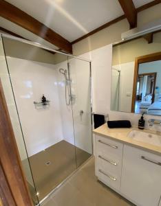 a bathroom with a shower and a sink at Beonne the Bay at Vivonne Bay, Kangaroo Island in Vivonne Bay