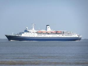 a large cruise ship sailing in the ocean at 1-bedroom holiday home in Otterndorf