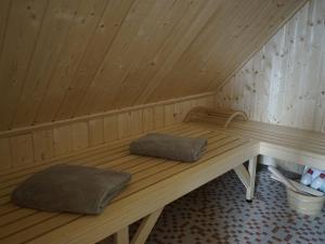 a wooden sauna with two pillows sitting in it at Holiday home in Vaschvitz with sauna in Vaschvitz