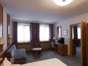 a living room with a couch and a television at Apartment in Vienna with 1 bedroom in Vienna +27 photos