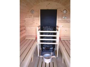 an inside view of a sauna at Holiday home with 4 bedrooms in Wittendün +13 photos