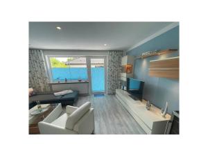 Et opholdsområde på Holiday home Bellaeins