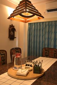 a table with a blender on top of it at Experience the grandeur of City of Joy at Anutham in Kolkata