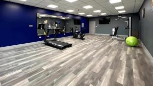a gym with a green exercise ball on the floor at Comfort Inn in Princeton +12 photos