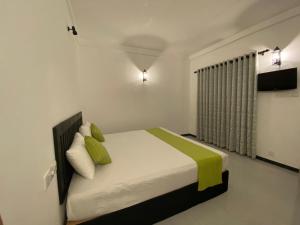Katil atau katil-katil dalam bilik di Seraphia Lodge Habarana