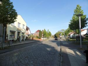 a cobblestone street in a small town at Seaside resort Altefähr in Altefähr