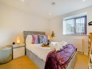 a bedroom with a bed and a window at Harebell- Uk45262 in Whitby