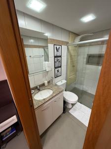 a bathroom with a sink and a toilet at Life Resort, Trabalho e Lazer! in Brasilia