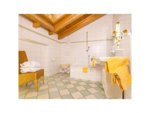 a bathroom with a sink and a toilet at Guesthouse Büchele in Hirschegg +36 photos