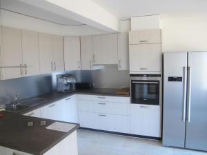 Η κουζίνα ή μικρή κουζίνα στο Blonay Holiday Apartments