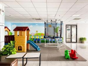 a room with a play area with a playground at D'Edge Thao Dien - SkyPool Paradise in Ho Chi Minh City