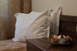 Postel nebo postele na pokoji v ubytování Pensiunea Görgő Panzió + 12 fotografií