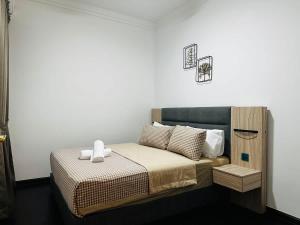 Ένα ή περισσότερα κρεβάτια σε δωμάτιο στο Ivory Homes at R&F - free WiFi and 1 Car Park