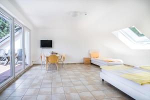 a living room with a couch and a table at Hotel an der Nordschleife in Adenau