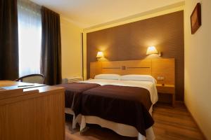 Letto o letti in una camera di Hotel 40 Nudos