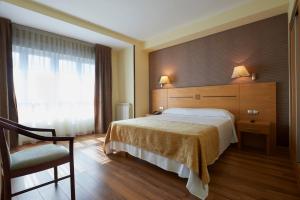 Letto o letti in una camera di Hotel 40 Nudos