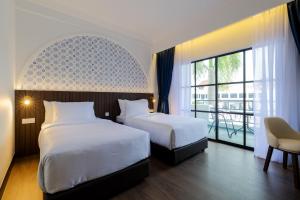 Postel nebo postele na pokoji v ubytování The Lisbon Melaka, Trademark Collection by Wyndham + 51 fotografií