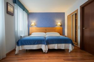 Letto o letti in una camera di Hotel 40 Nudos