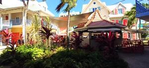 a small building with a tent in front of it at Martinique 3 ILETS POINTE DU BOUT T2 35M2 in Les Trois-Îlets