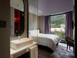 Katil atau katil-katil dalam bilik di Tango Inn Taipei Jihe