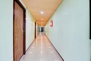 an empty corridor in a building with a hallway at Super Collection O Rama Lakshmana Junction Srikakulam in Srīkākulam